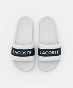 Lacoste CROCO SLIDE - Mules - White/navy 11 Lacoste CROCO SLIDE - Mules - White/navy -Lacoste Soldes Magasin 325db4591f324c8681aae19f2477c6d6
