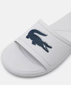 Lacoste SLIDE UNISEX - Sandales De Bain - White/dark Blue -Lacoste Soldes Magasin bdac43c66f0f4150bab76c283140bc14